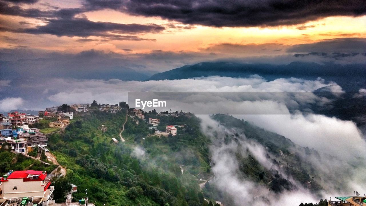 Scenic view of town against sky