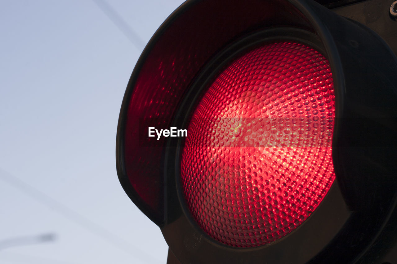 Low angle view of red traffic light