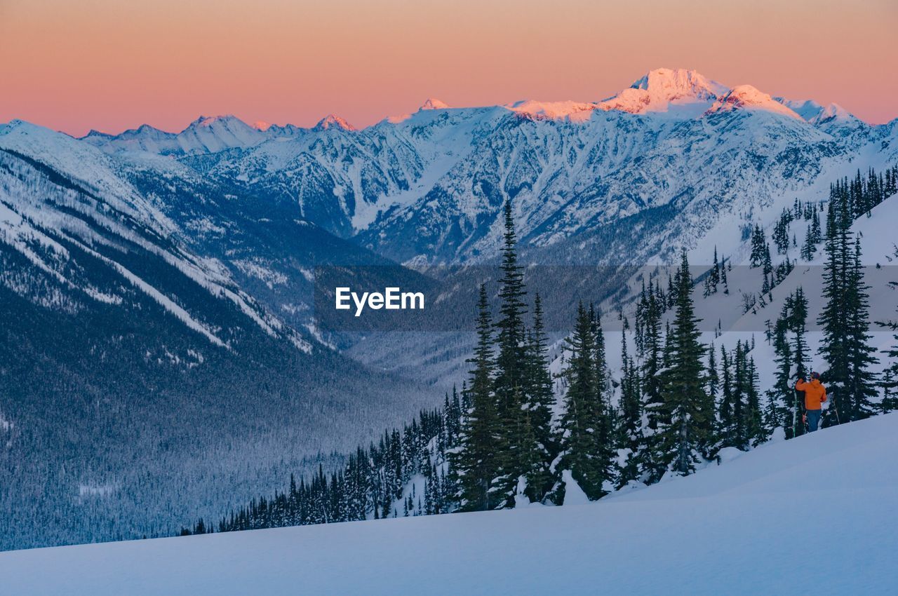 Scenic view of snow covered mountains against sky