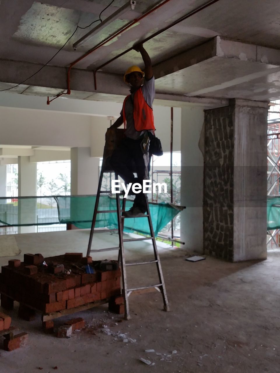 MAN WORKING AT SHOPPING MALL