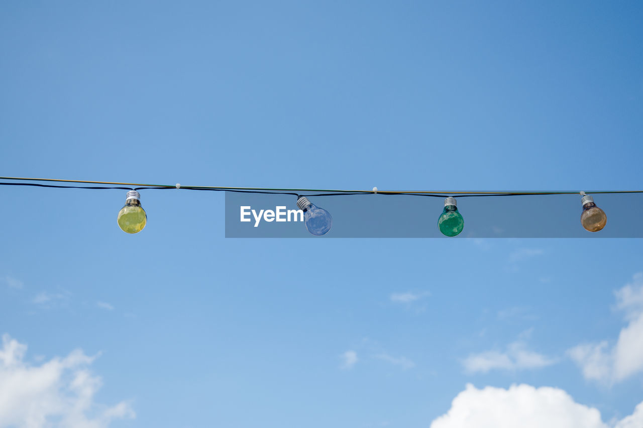 LOW ANGLE VIEW OF CABLES AGAINST CLEAR SKY