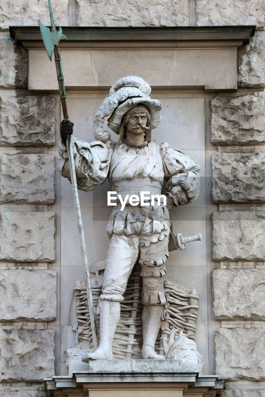 Anton schmidgruber statue against wall at kunsthistorisches museum