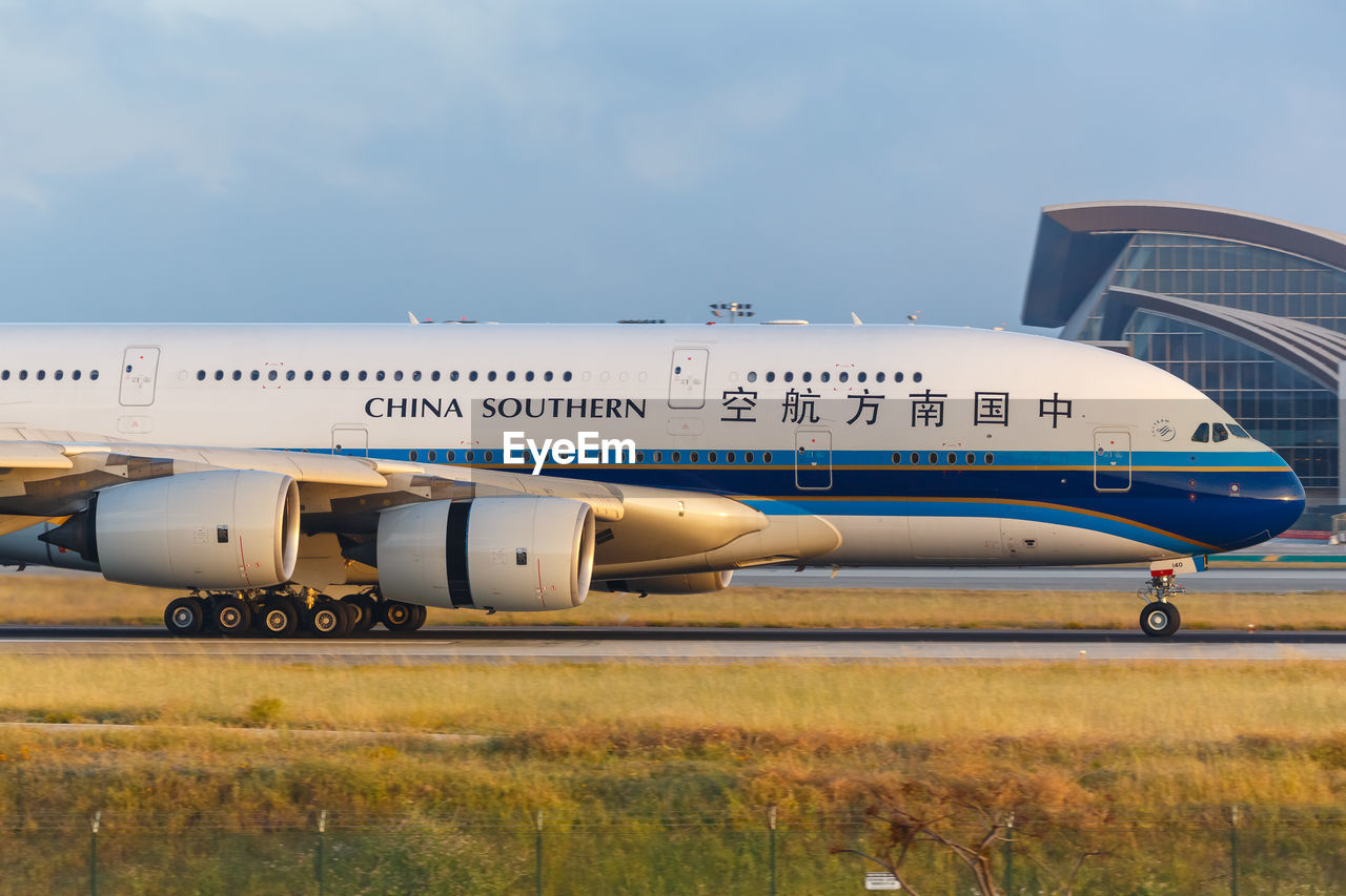 VIEW OF AIRPLANE ON FIELD