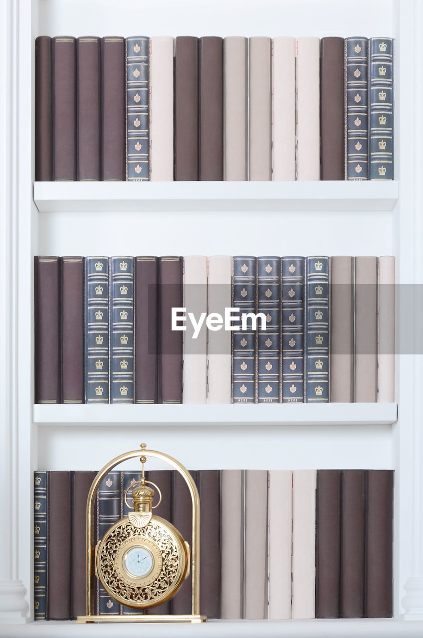 CLOSE-UP OF OPEN BOOK ON TABLE IN OFFICE