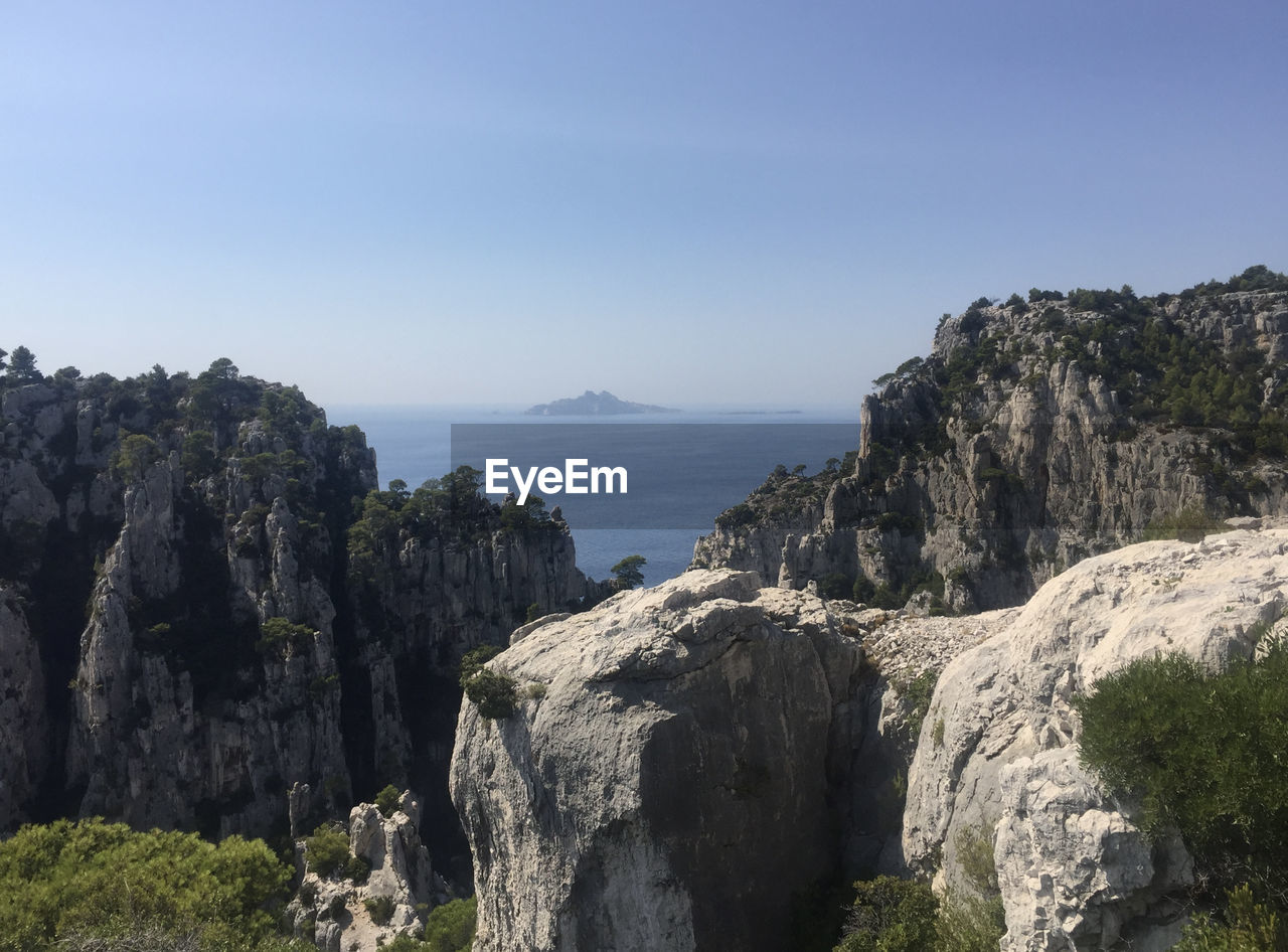 View of the riou island and archipelago from the steep cliffs of the calanque d'en vau in marseille.