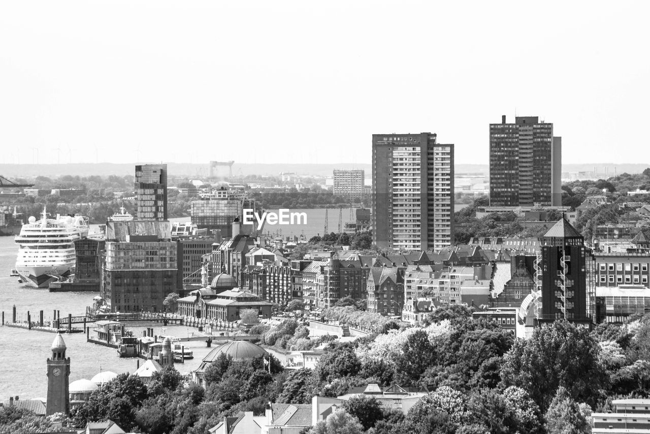 High angle view of buildings against clear sky