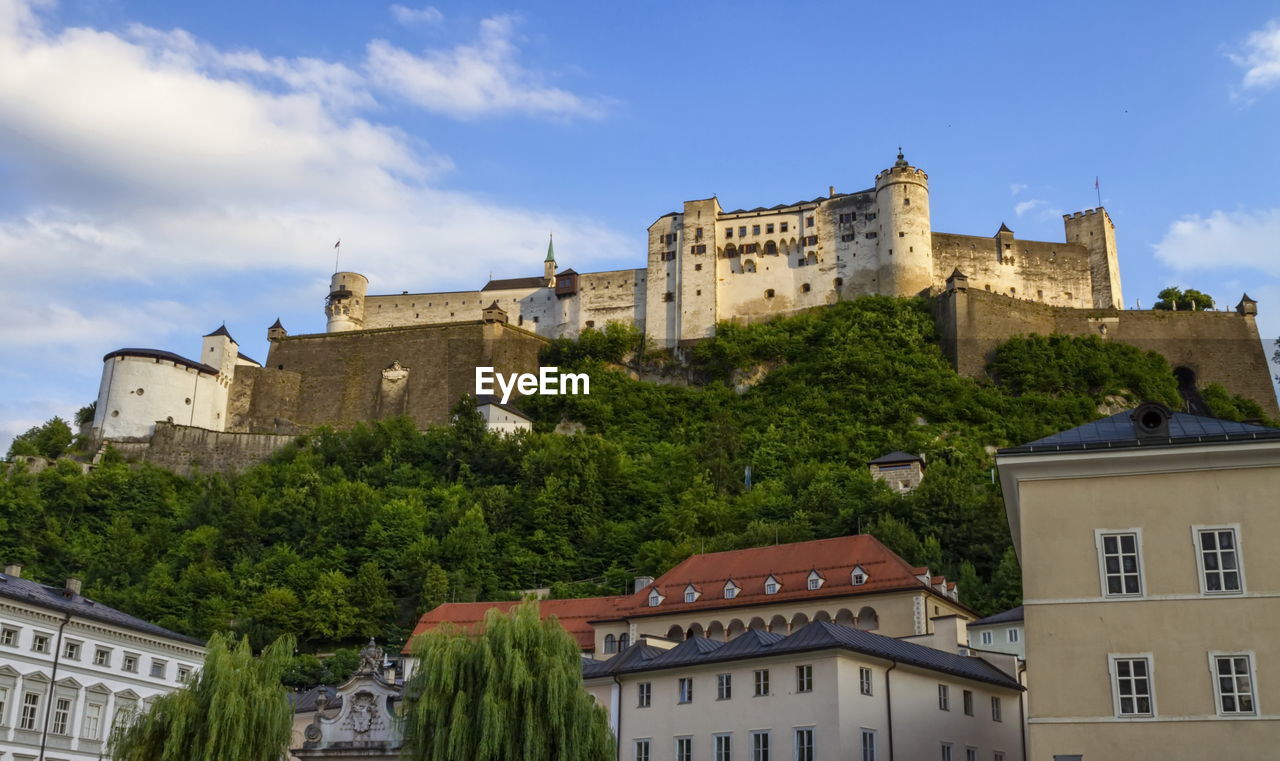 Famous hohensalzburg fortress on a hill in salzburg by day, austria