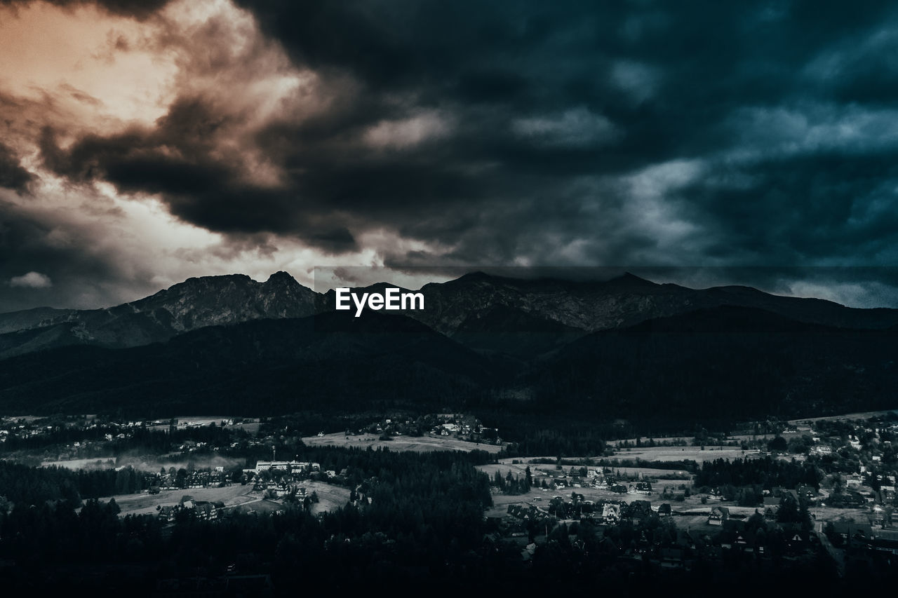 Aerial view of storm clouds over mountains
