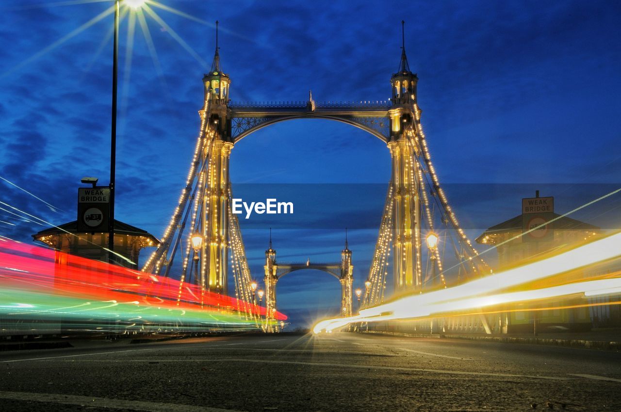 VIEW OF SUSPENSION BRIDGE AT NIGHT