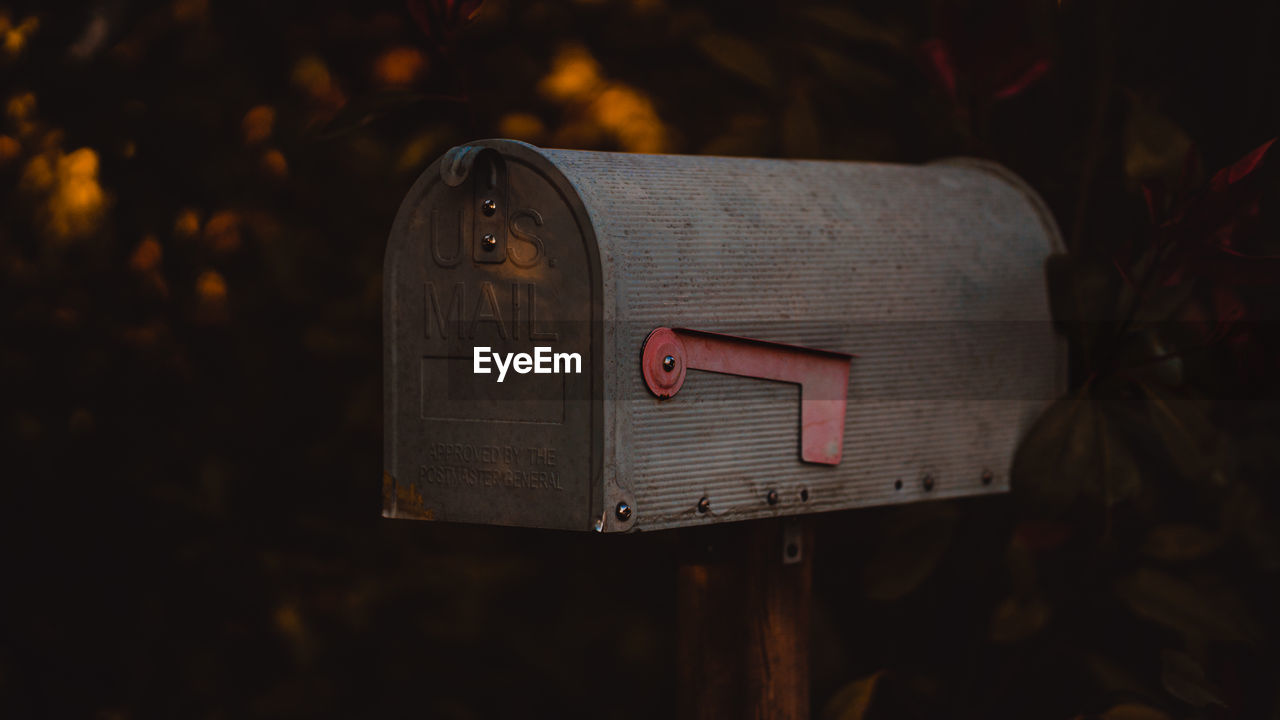 Close-up of mailbox against trees