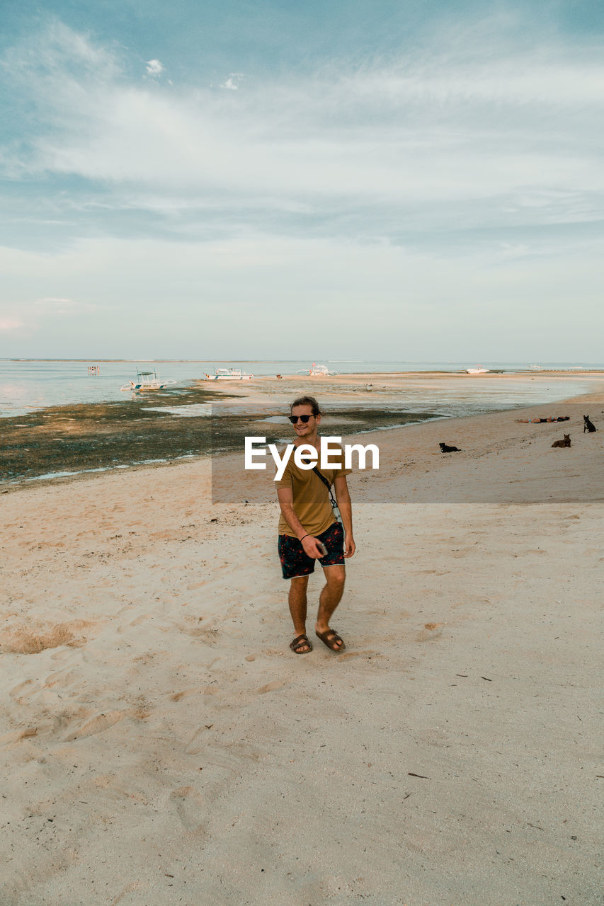 FULL LENGTH OF BOY ON BEACH