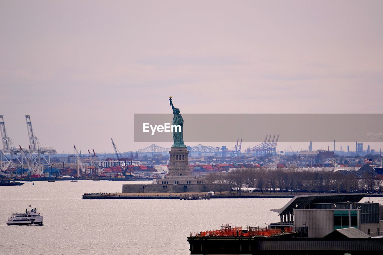 Scenic view of statue of liberty and construction work