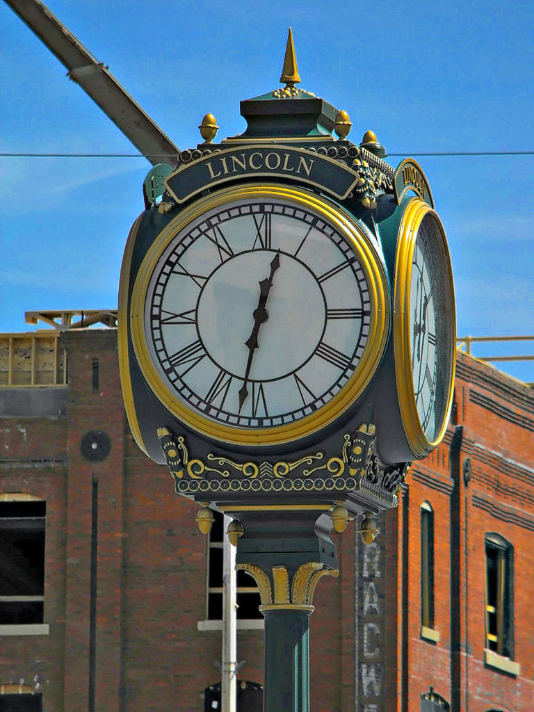 LOW ANGLE VIEW OF CLOCK TOWER AGAINST SKY