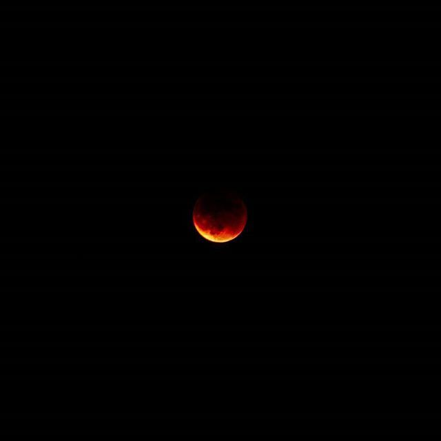 LOW ANGLE VIEW OF MOON OVER THE SKY