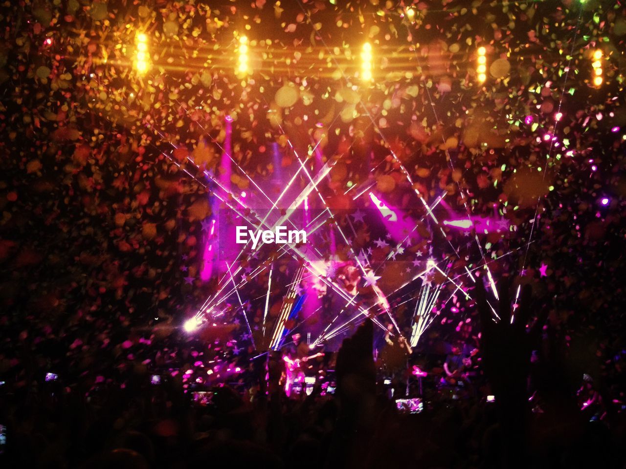 Rock concert with excited people cheering