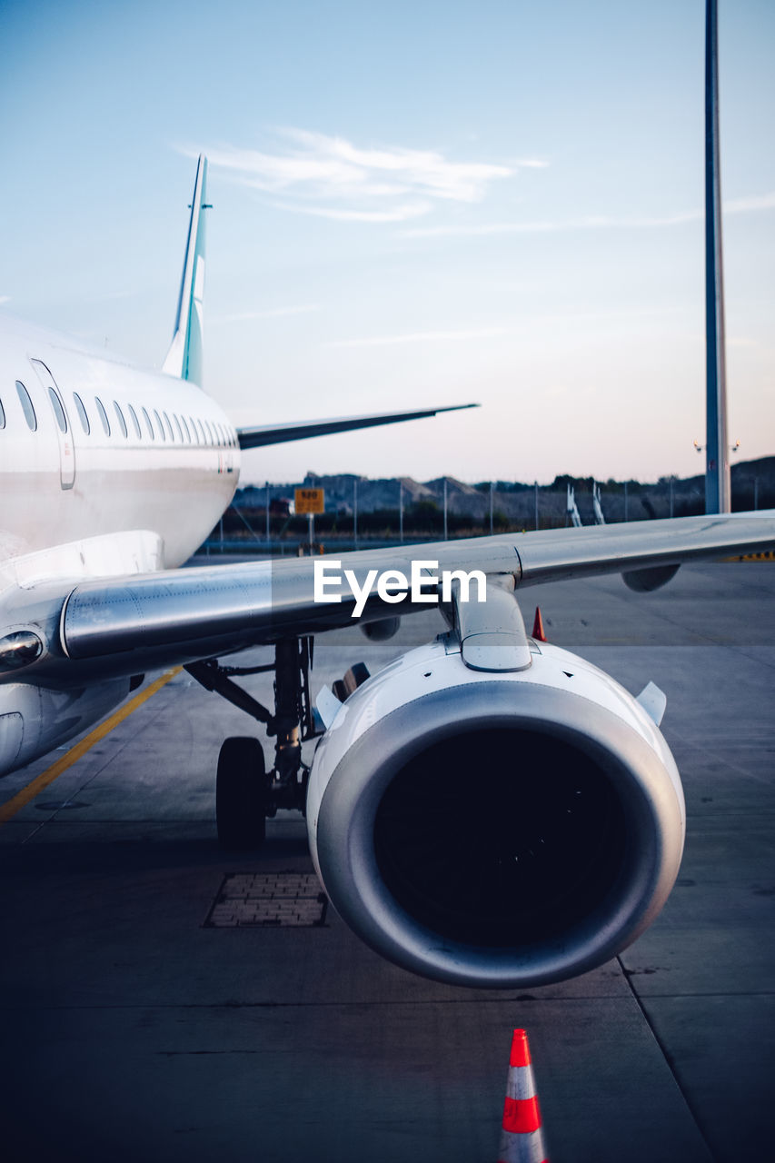 low angle view of airplane flying against sky