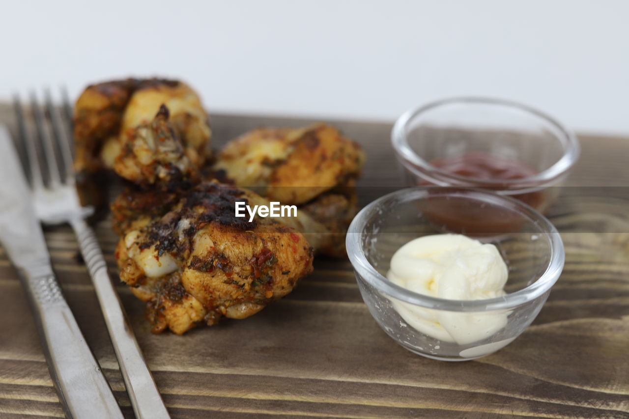 food and drink, food, dish, freshness, breakfast, healthy eating, produce, dessert, meal, no people, wellbeing, indoors, studio shot, wood, eating utensil, baked, kitchen utensil, fried food, household equipment, close-up, meat, vegetable, focus on foreground, cuisine, table, plant