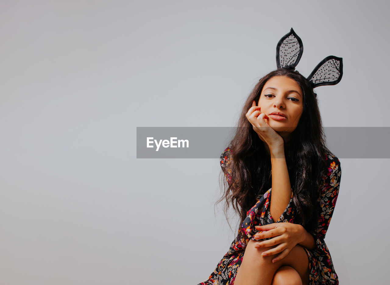 Close up portrait of pretty girl with bunny ears. easter themed fashion editorial.