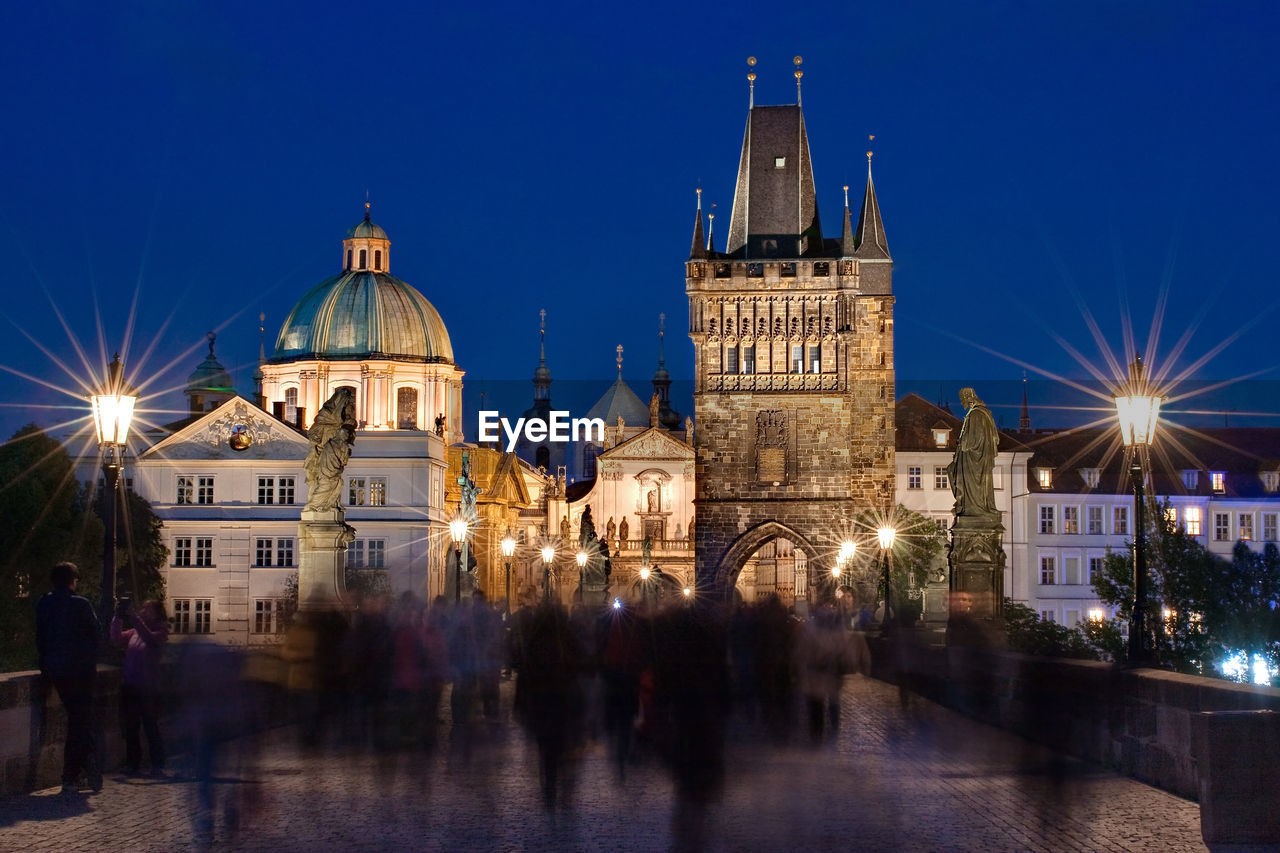 Illuminated buildings in city at night