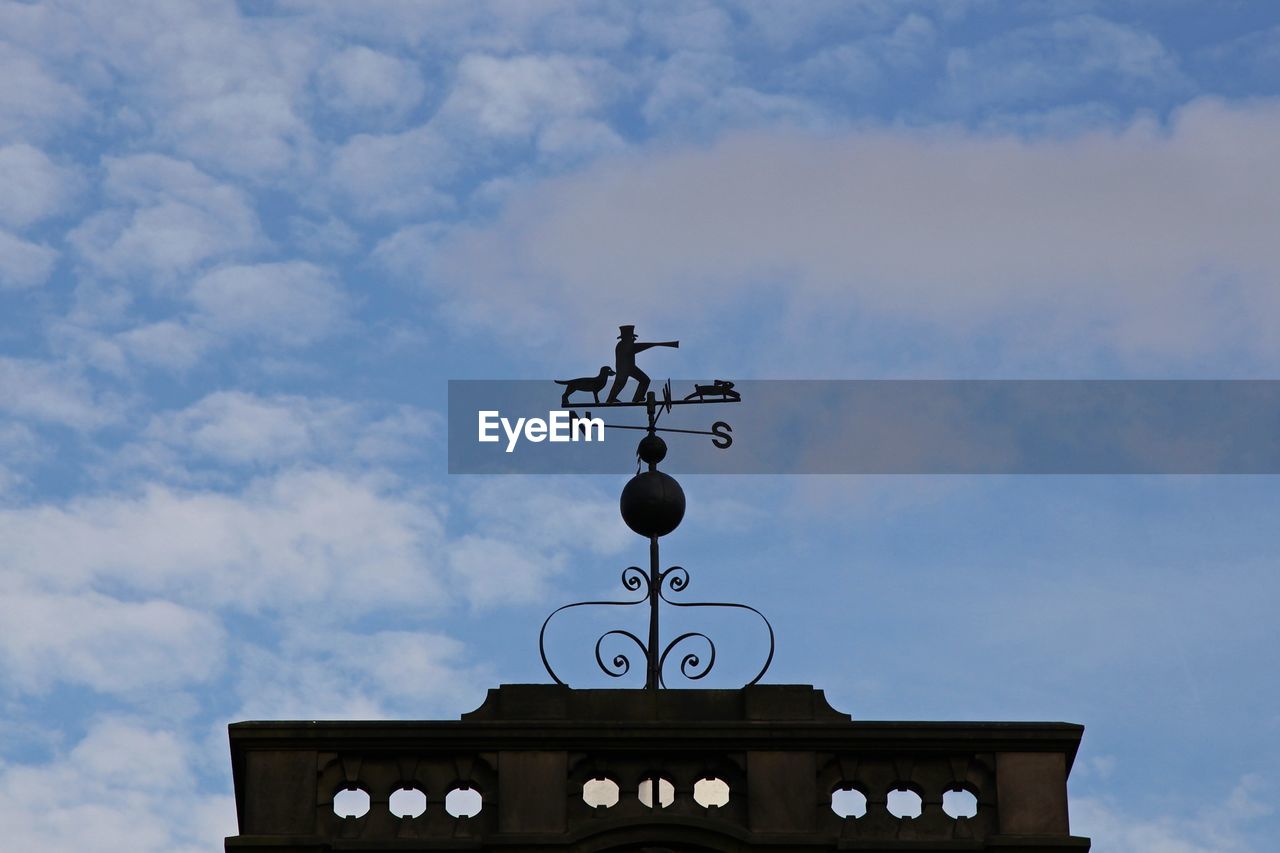 LOW ANGLE VIEW OF TOWER AGAINST CLOUDY SKY