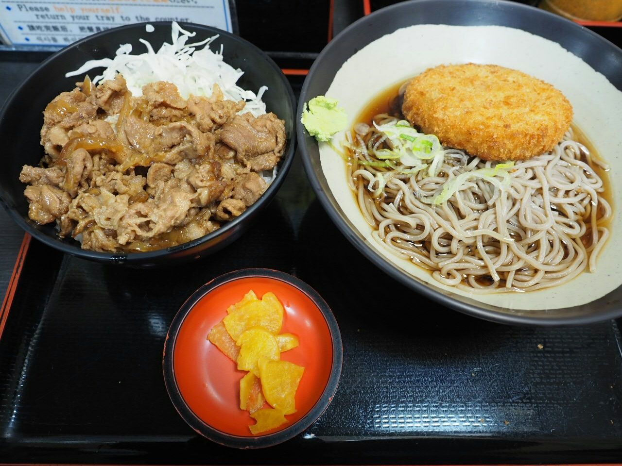 High angle view of noodles with meat served on table