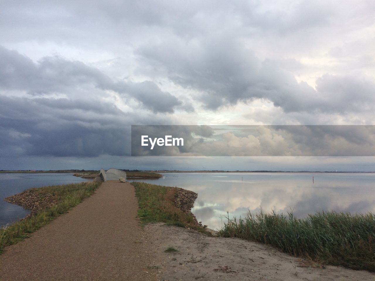 Scenic view of sea against storm clouds