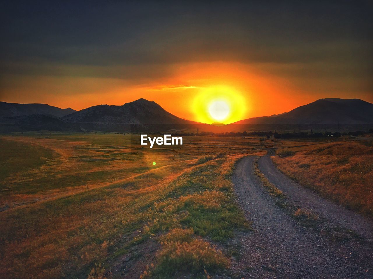 SCENIC VIEW OF MOUNTAINS DURING SUNSET