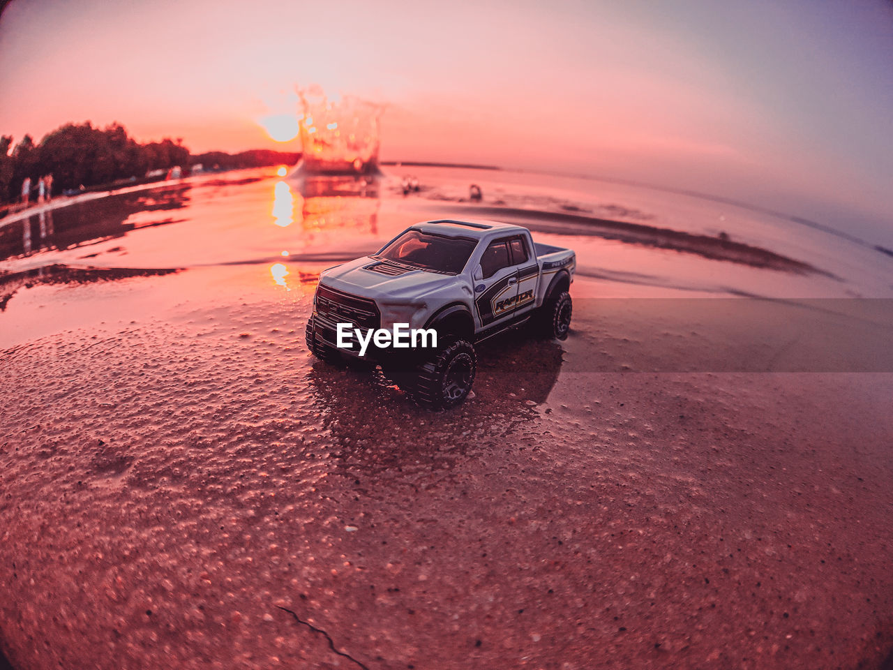 VIEW OF CAR ON BEACH