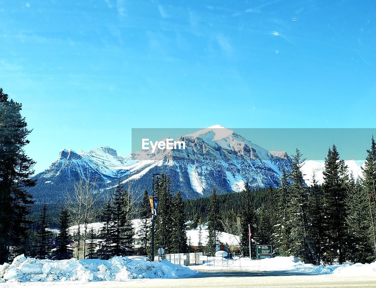 Snow covered landscape against sky