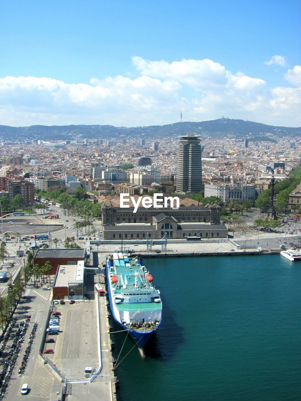 HIGH ANGLE VIEW OF SHIP SAILING IN RIVER AGAINST SKY