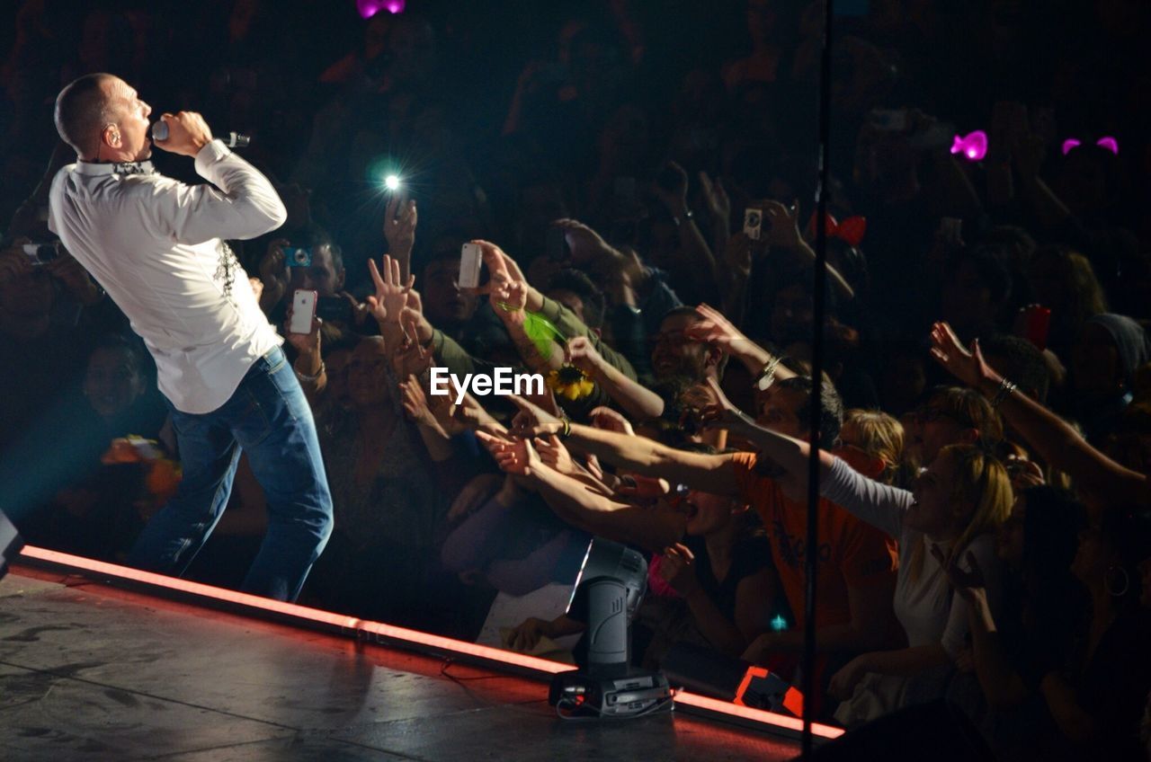 GROUP OF PEOPLE AT CONCERT