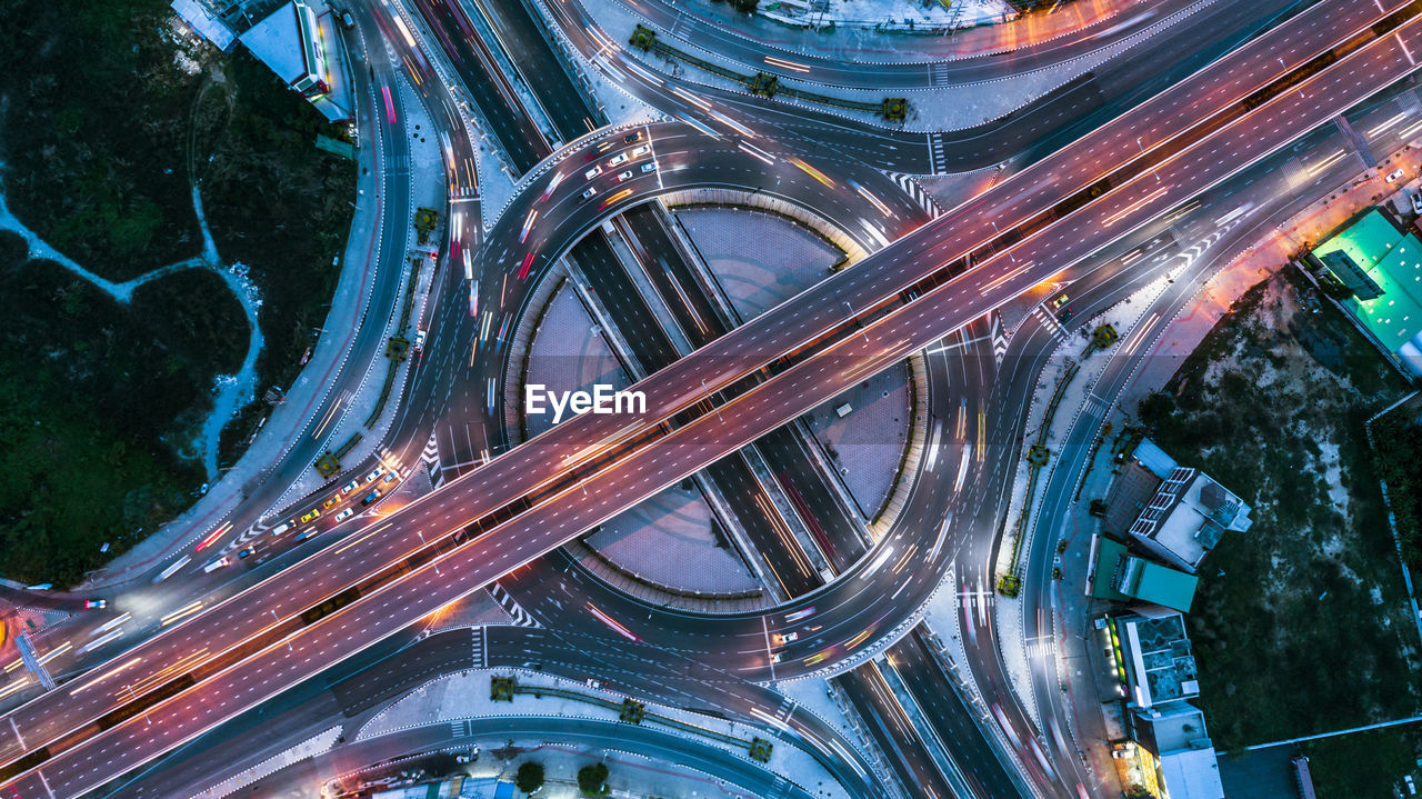 Aerial view of illuminated highways at night