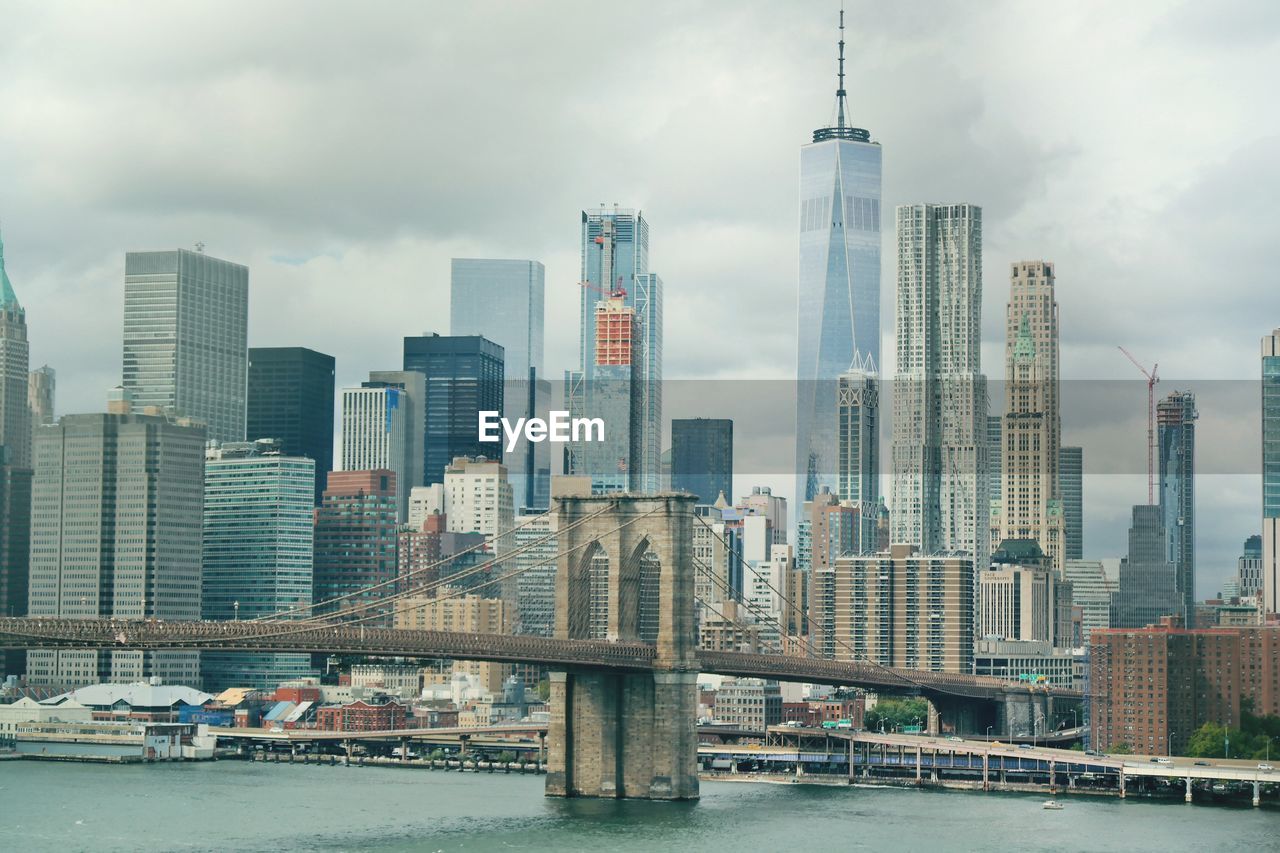 View of skyscrapers against cloudy sky