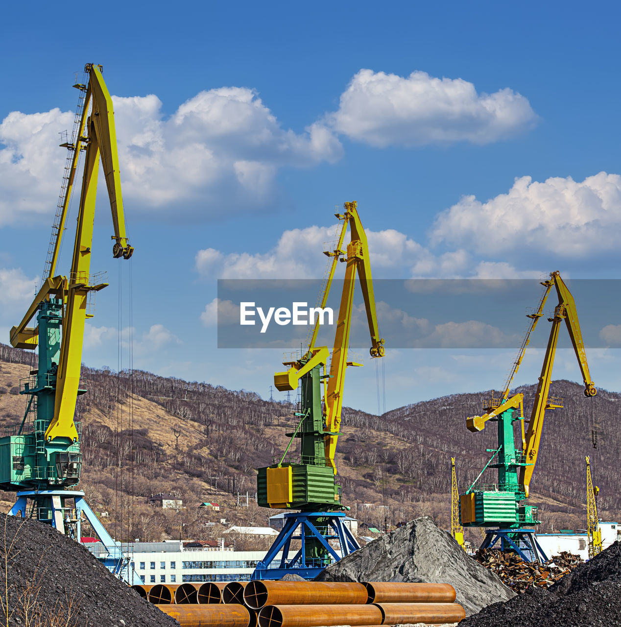 Crane at the scrapyard in the seaport in kamchatka peninsula