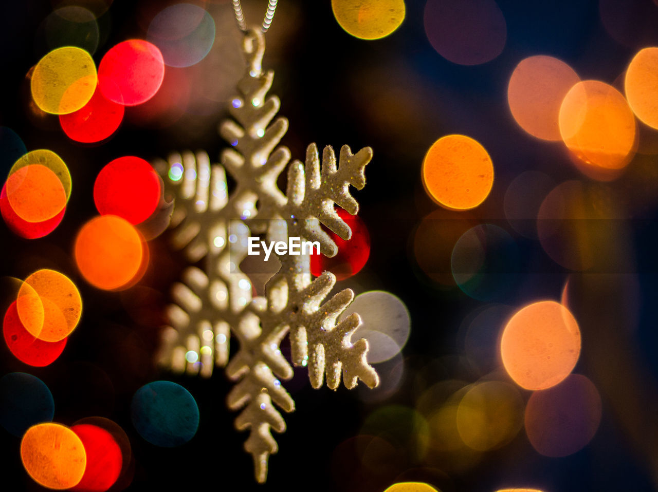 Close-up of christmas decoration against defocused lights