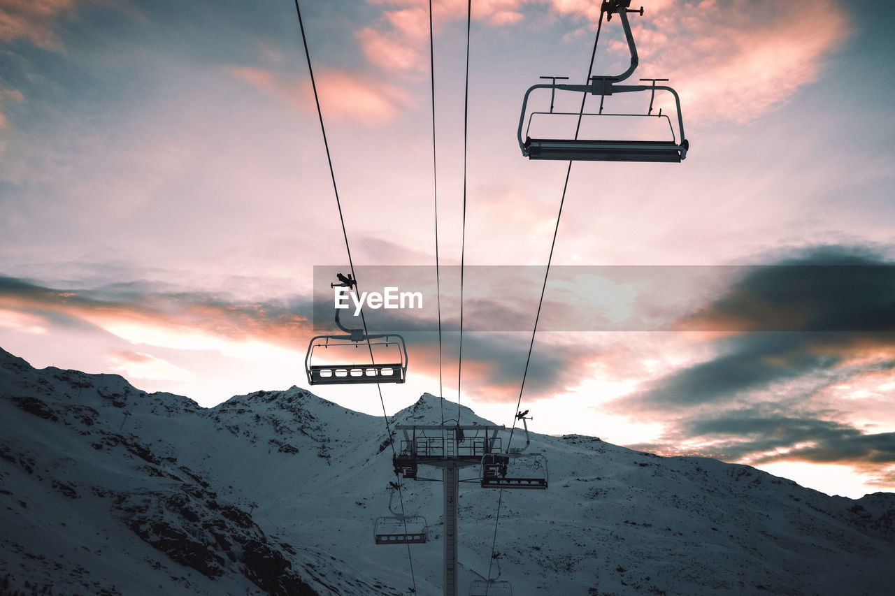 Overhead cable car against sky during winter