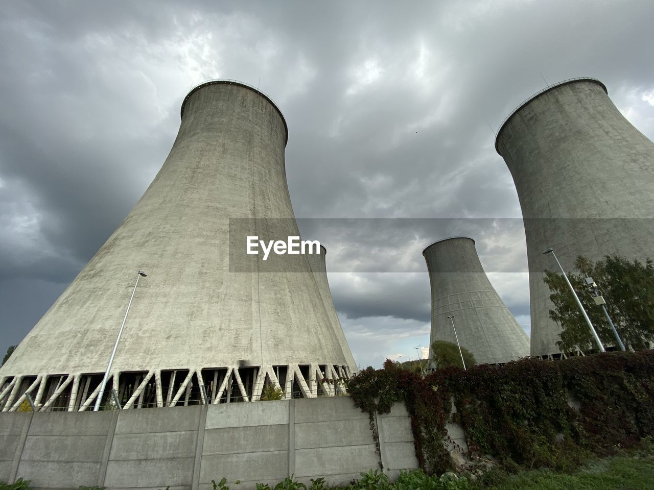 Low angle view of smoke stack against sky