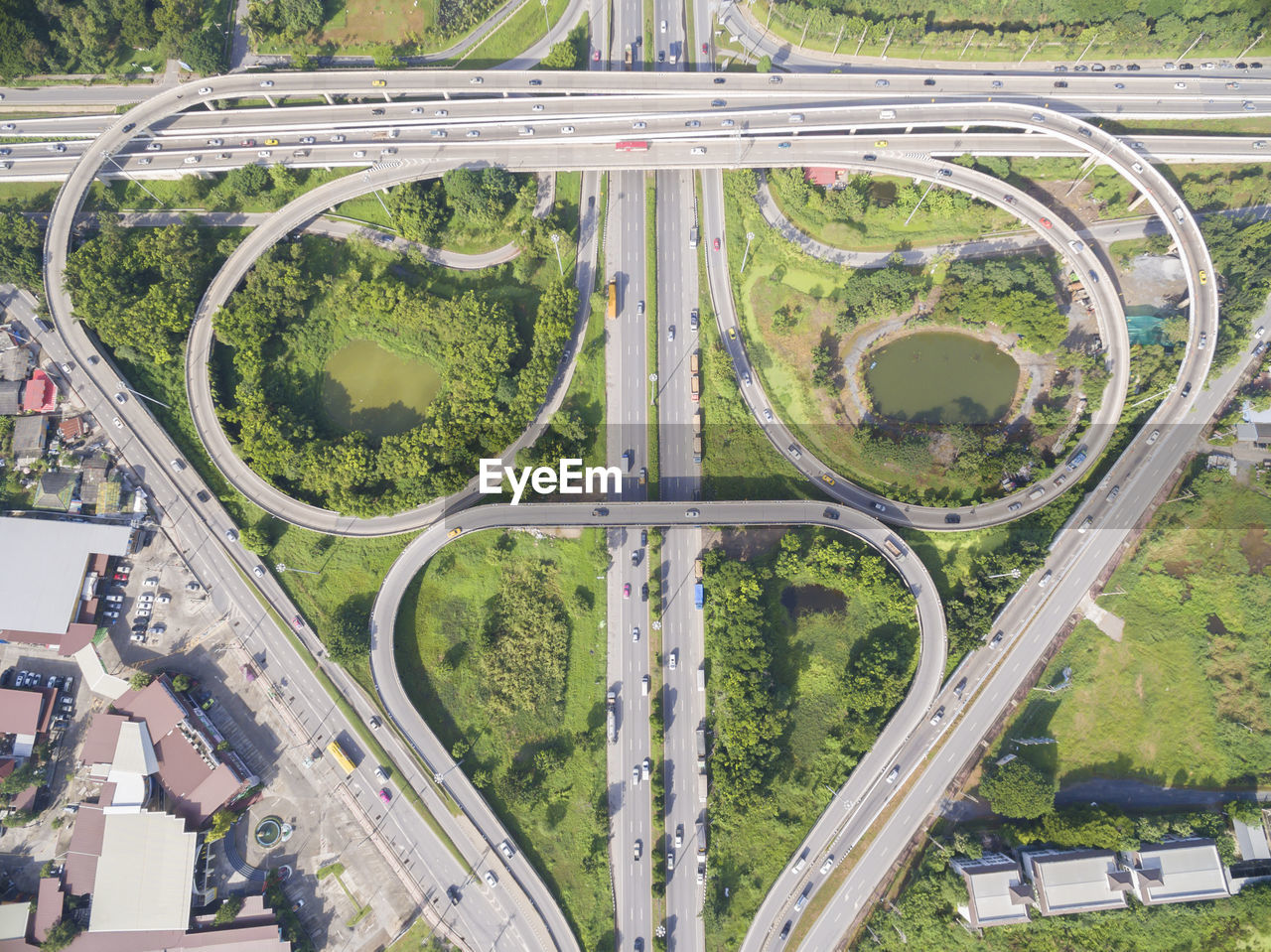 HIGH ANGLE VIEW OF ELEVATED ROAD BY CITY