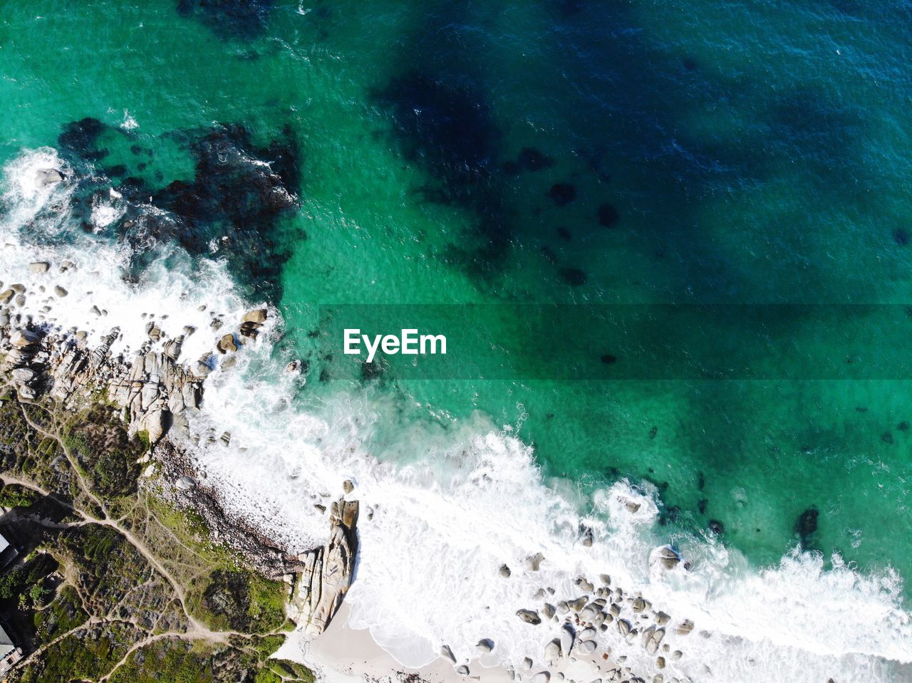 High angle view of rocks in sea