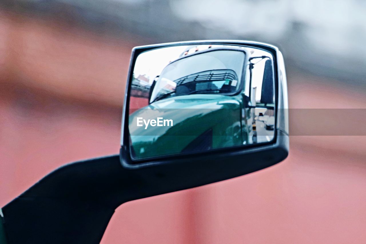 Close-up of vintage car on side-view mirror