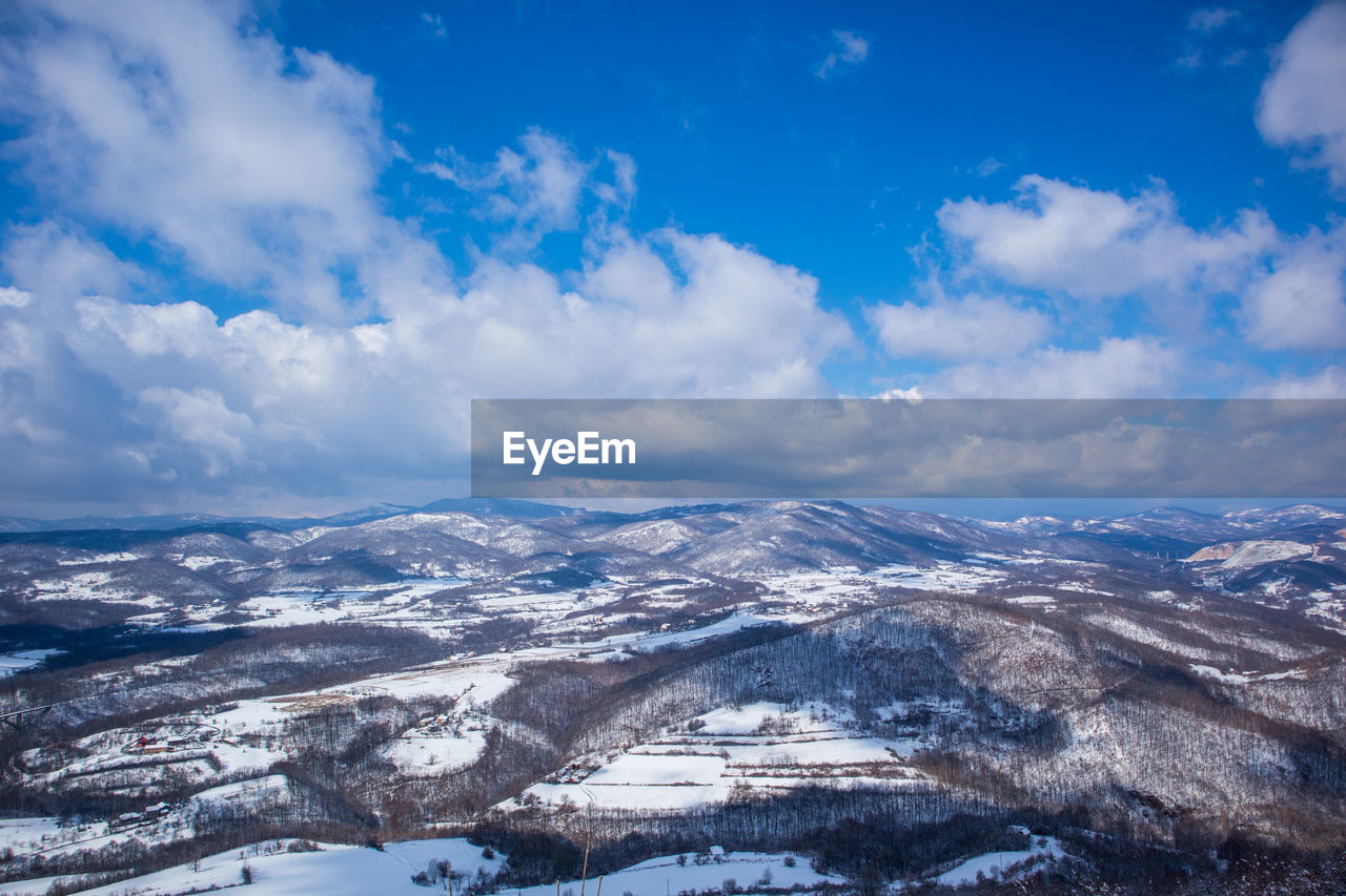 Aerial view of valley against sky