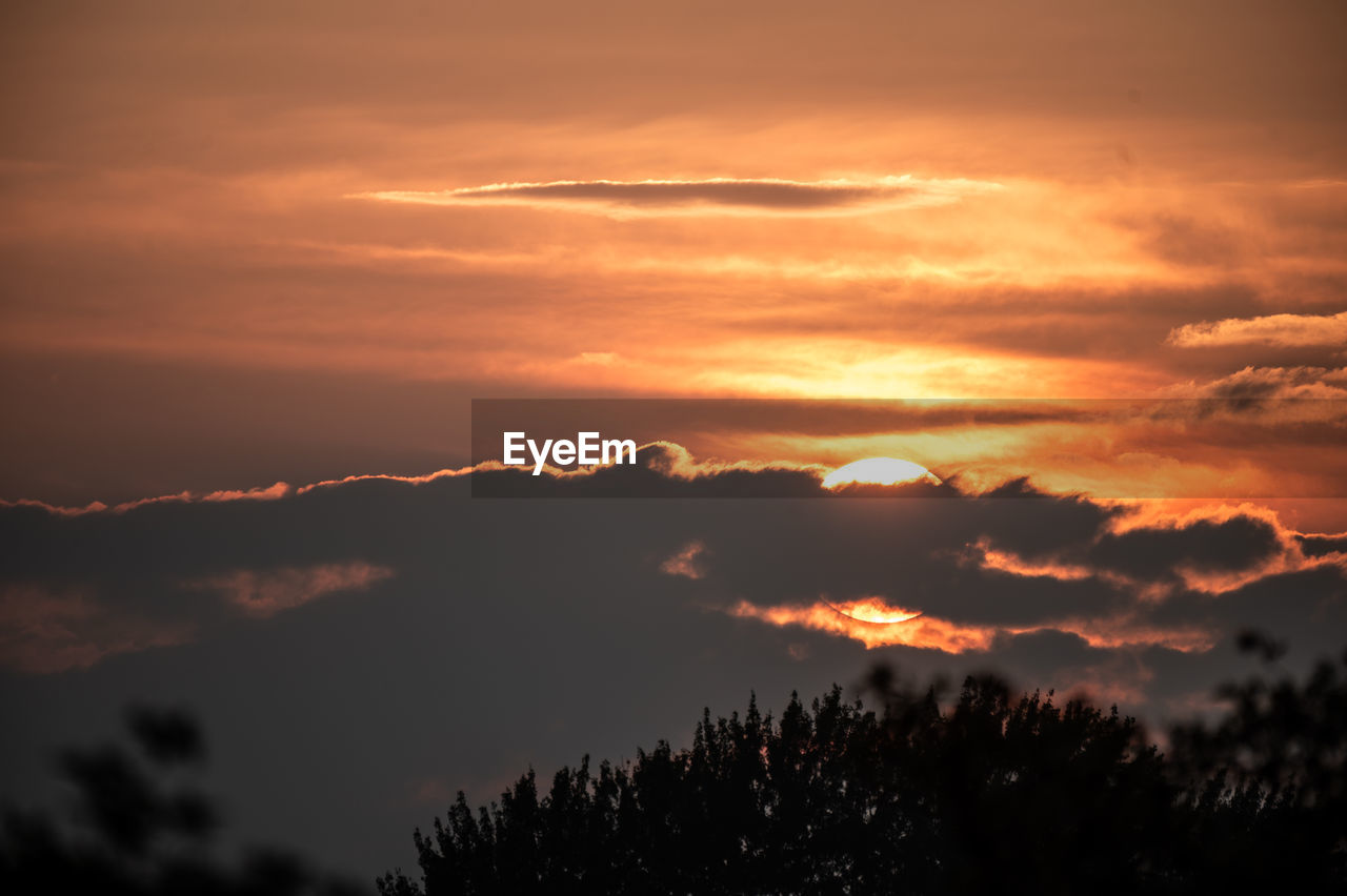 sky, cloud, beauty in nature, tree, sunset, scenics - nature, tranquility, nature, silhouette, environment, tranquil scene, plant, dramatic sky, no people, idyllic, orange color, landscape, afterglow, sunlight, red sky at morning, forest, outdoors, cloudscape, atmospheric mood, mountain, non-urban scene, evening, dawn, sun, land, awe, travel destinations