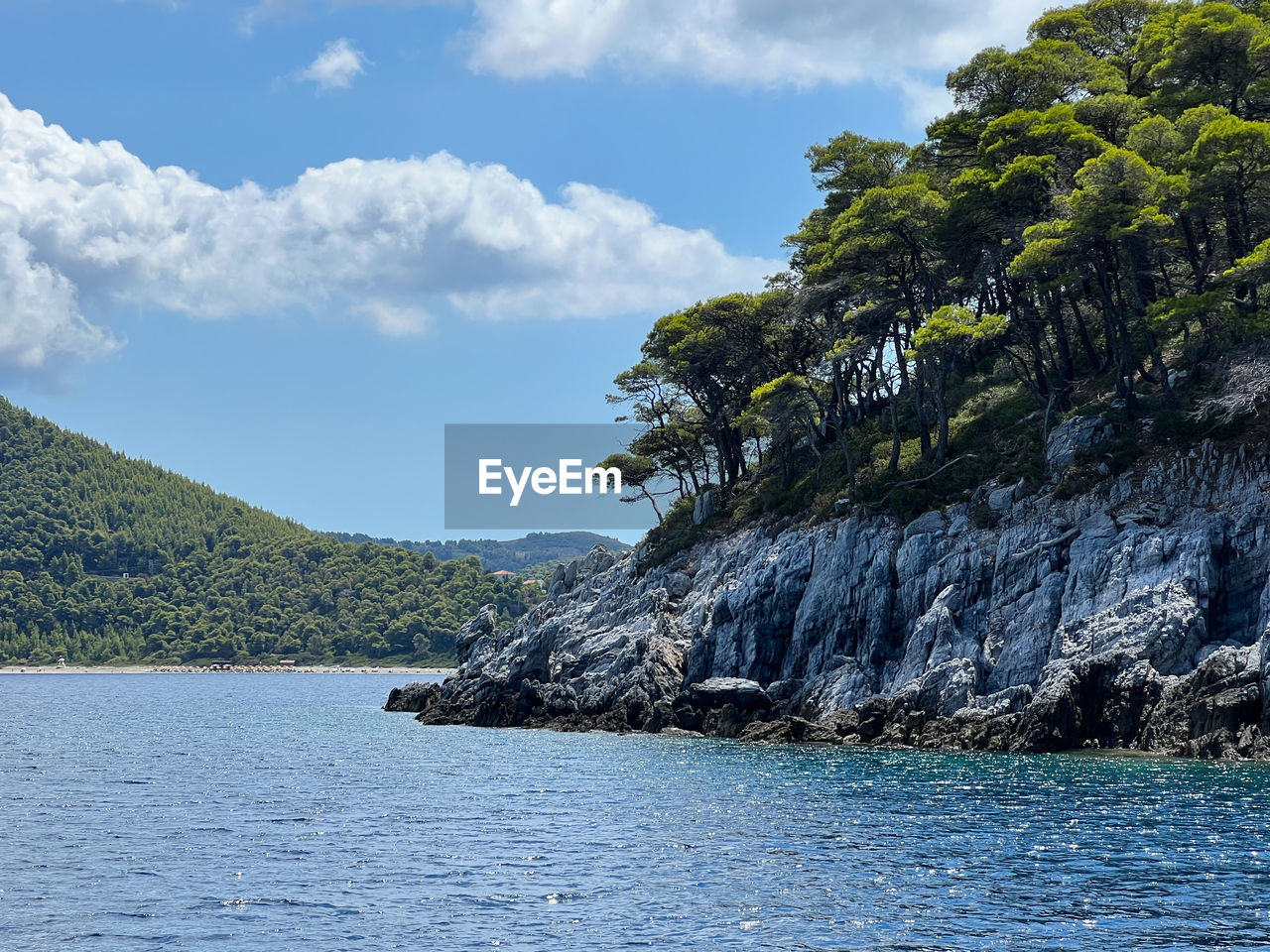 water, sea, sky, scenics - nature, beauty in nature, land, nature, coast, cloud, tree, environment, body of water, mountain, shore, landscape, plant, rock, no people, beach, bay, travel destinations, travel, ocean, tranquility, tranquil scene, island, outdoors, non-urban scene, tourism, coastline, day, idyllic, blue, cliff, tropical climate, lagoon, vacation, holiday, trip, forest, animal wildlife