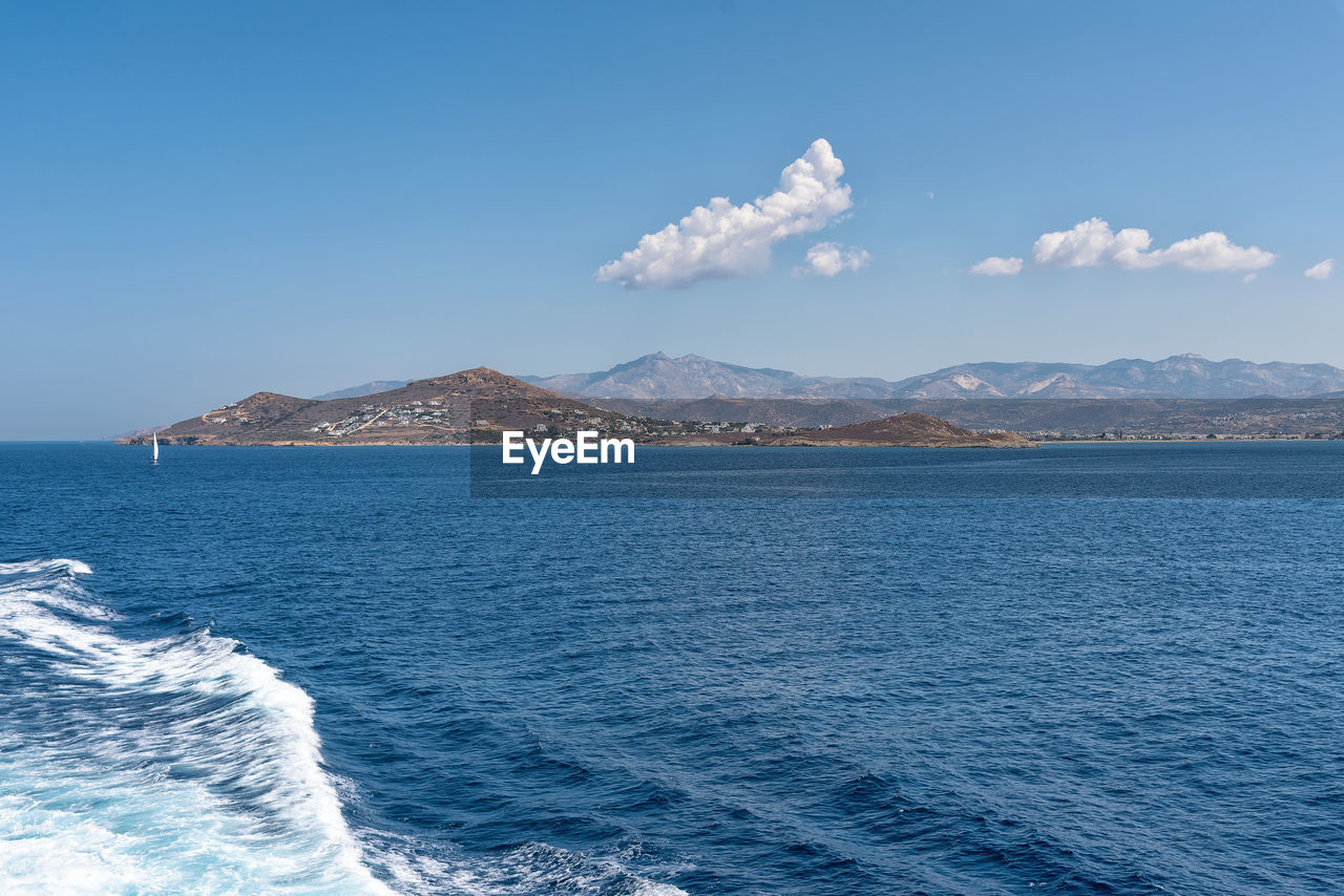 Scenic view of sea against blue sky