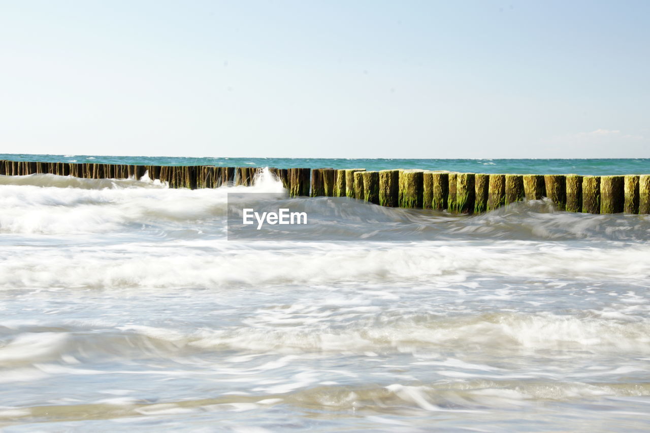 Scenic view of sea against clear sky
