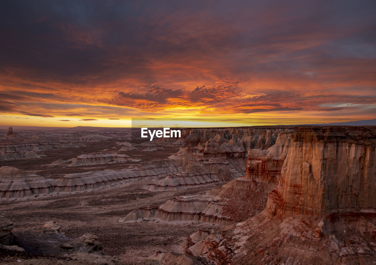 Epic sunrise aerial panorama above massive coal mine canyon on n