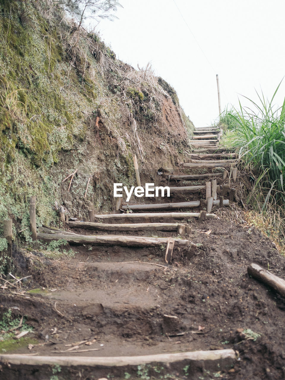 STEPS ON LANDSCAPE AGAINST SKY