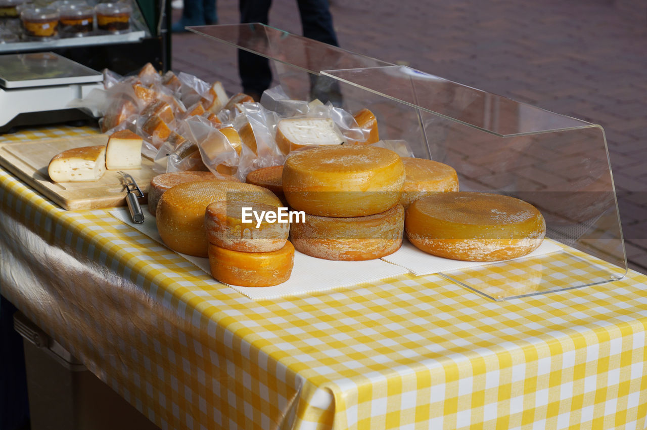 Cheese wheels for sale at market