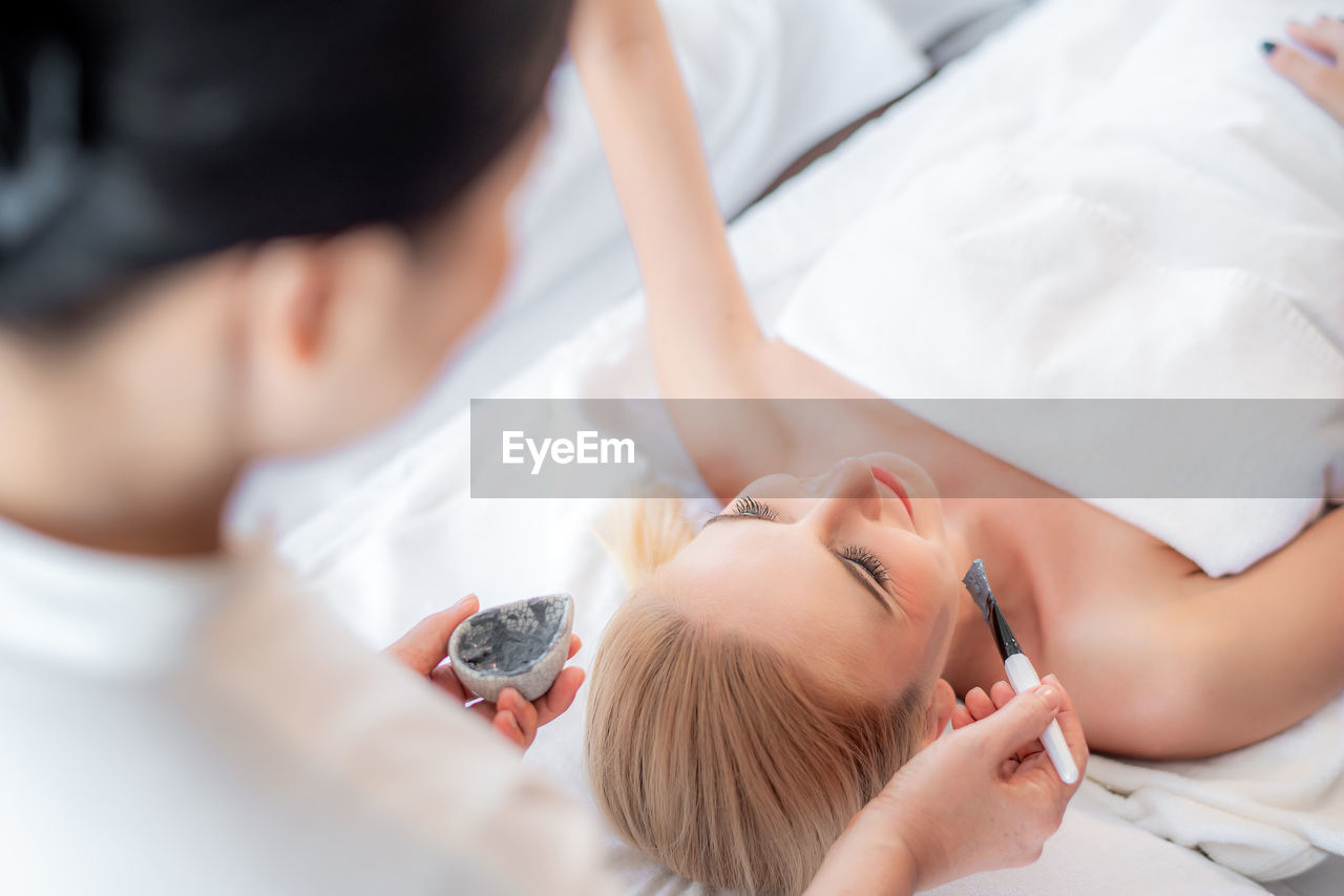high angle view of doctor examining patient