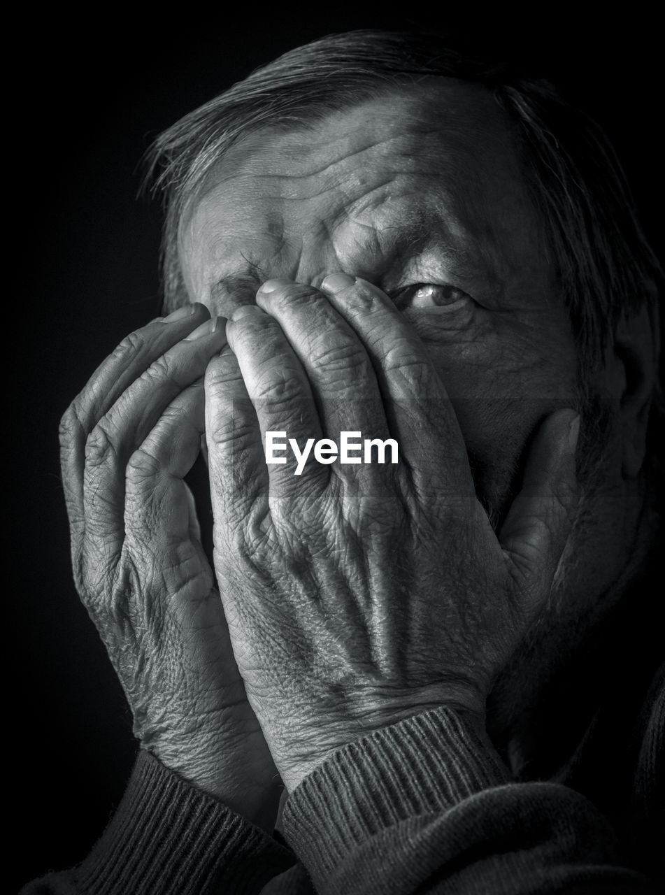 Elderly pensive man black and white portrait